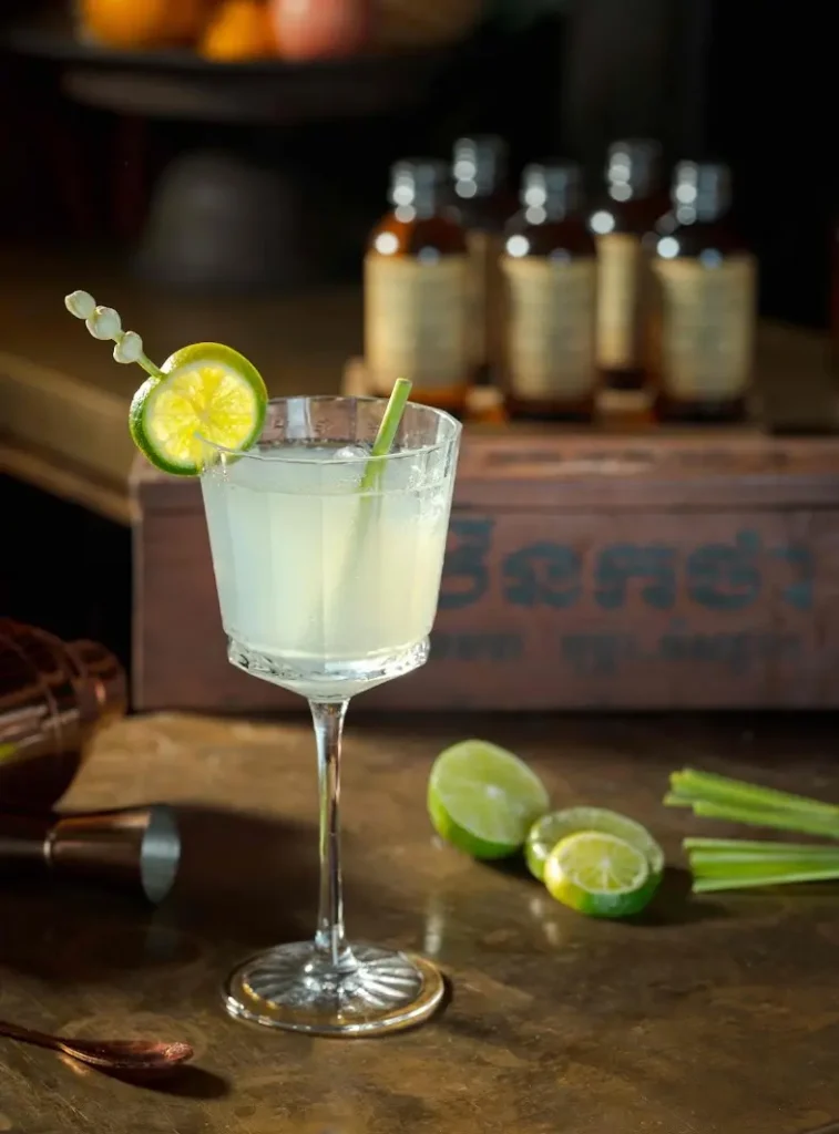 Lemongrass gin cocktail with Herbal Kulen gin, fresh lime and lemongrass garnish.