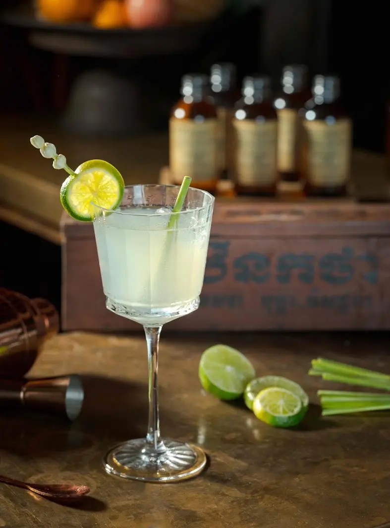 Lemongrass gin cocktail with Herbal Kulen gin, fresh lime and lemongrass garnish.